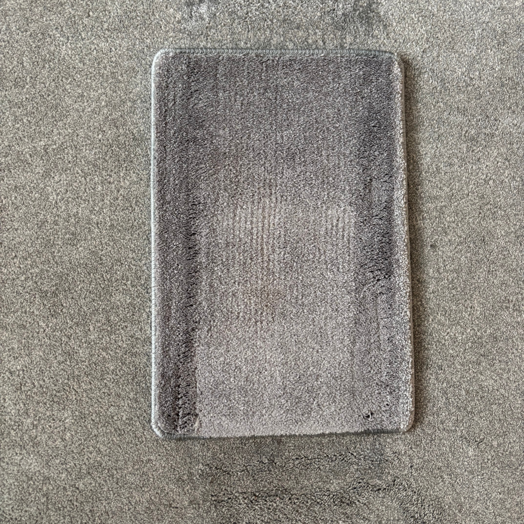 Carpet sample after using the ONEPWR Cordless Compact Carpet Cleaner to remove ketchup stains