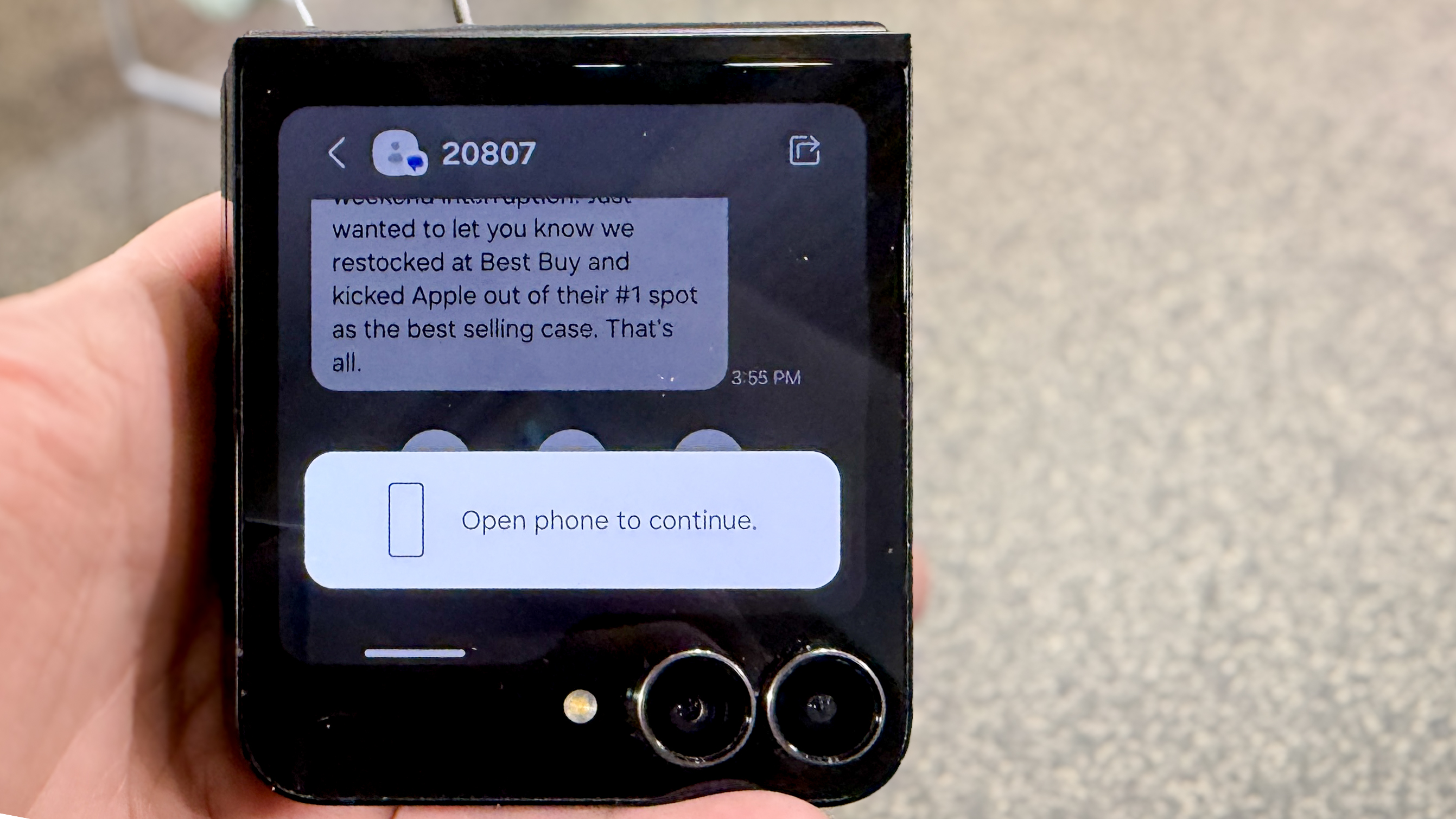 Samsung Galaxy Z Flip 7 FE in piano black color showing content on the cover display and the main screen