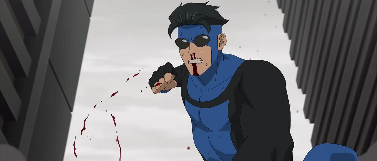 An angry Mark punching someone on the ground as blood flies off his right fist in Invincible season 4