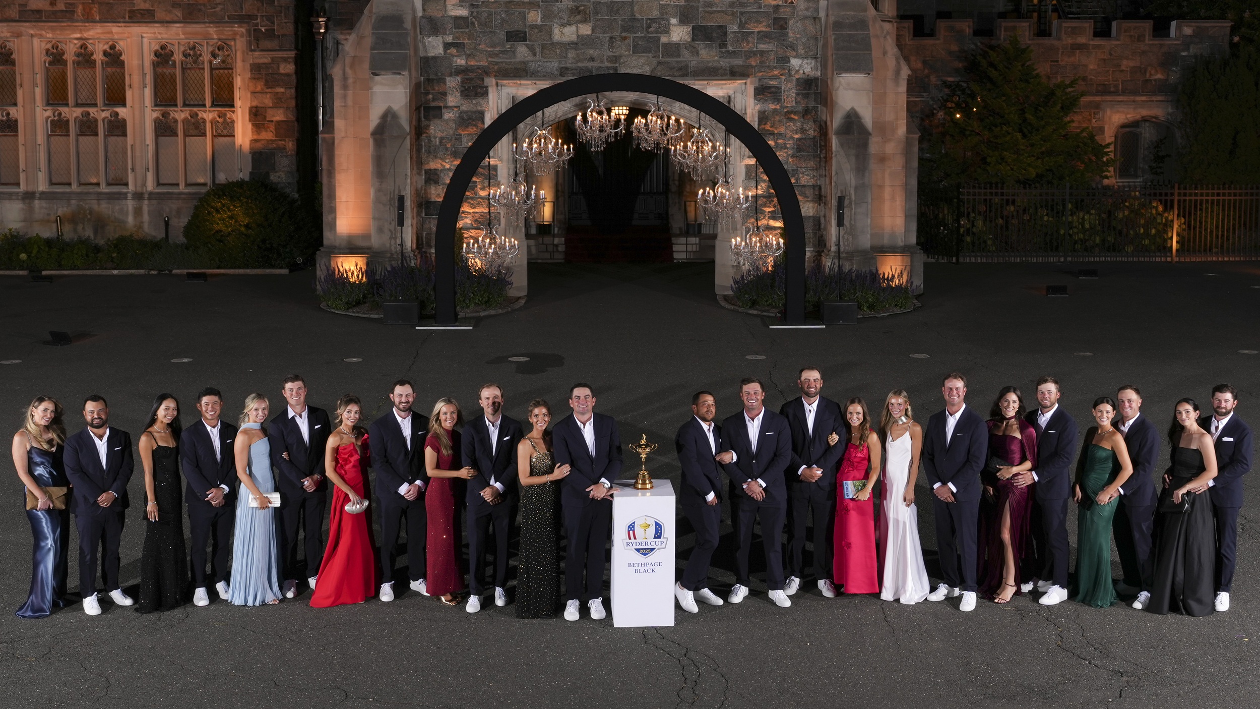 Team USA players and wives and girlfriends pose at the Ryder Cup gala dinner