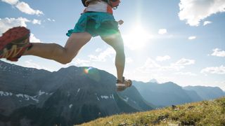 Woman running on hillside