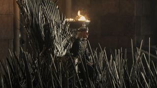 King Aegon II listens to some off-camera peasants as he sits on the Iron Throne in House of the Dragon season 2