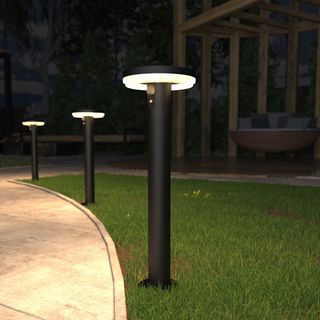 4lite Antheia Solar Bollard lining pathway on grass in garden