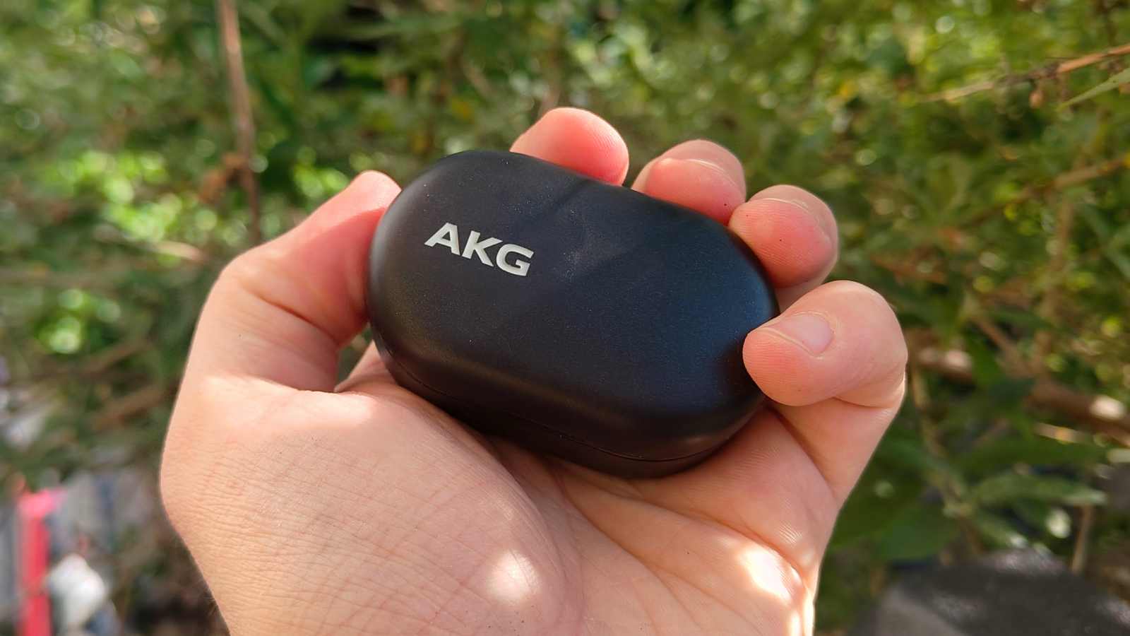 The AKG N5 in a man's hand.
