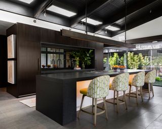 Large kitchen with black wood ceiling paneling