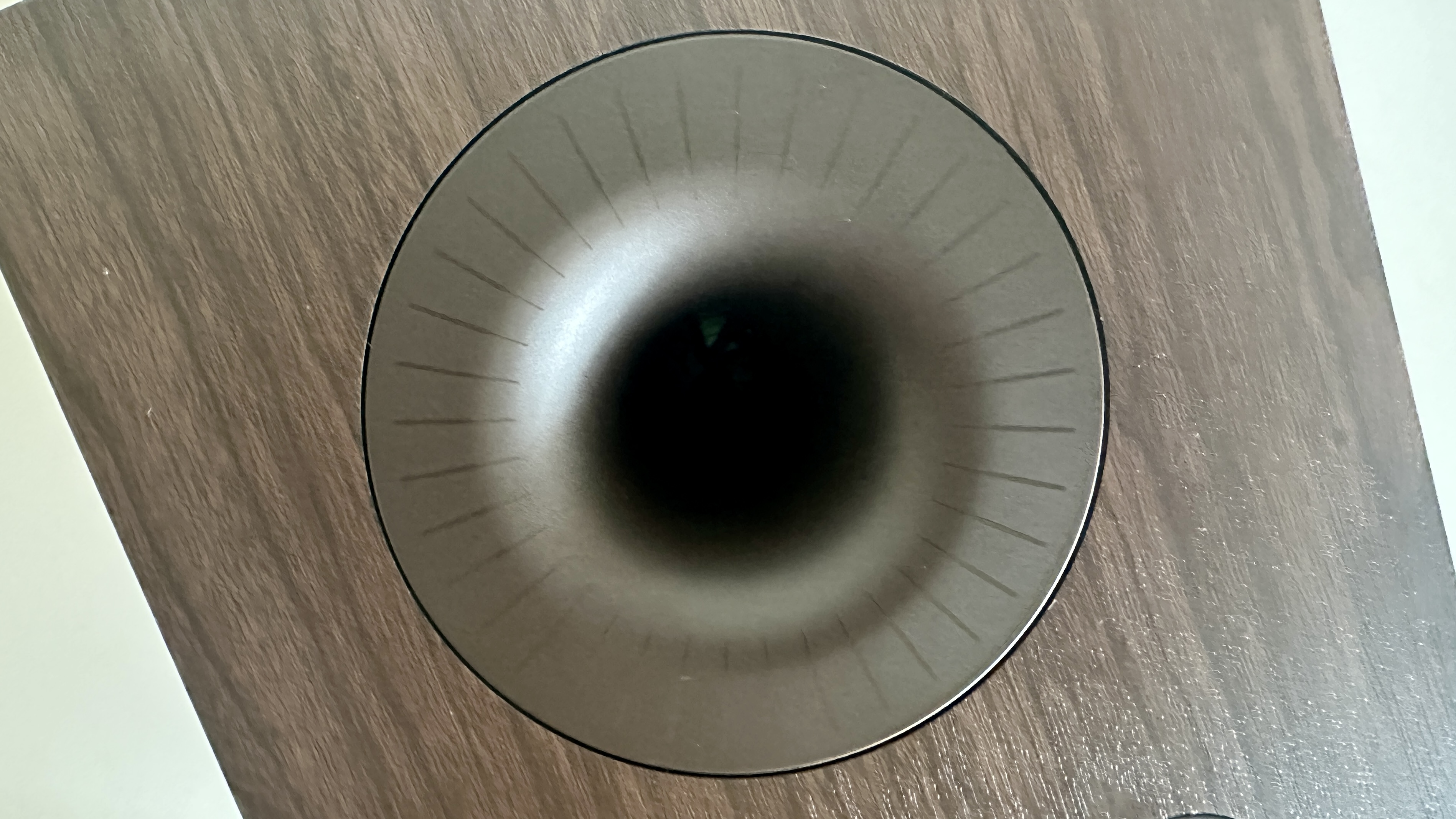 Rear-firing bass reflex port of the Dali Kupid bookshelf speaker.