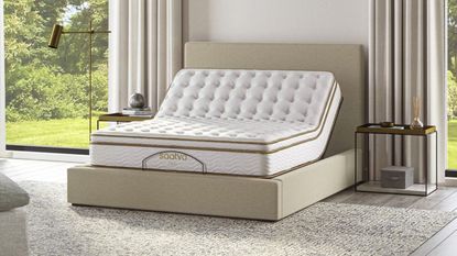 A Saatva adjustable bed base with a Saatva mattress in a modern bedroom