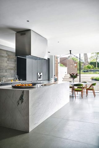 A modern kitchen with concrete floors