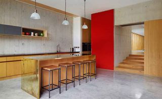 Contemporary kitchen-diner with shuttered concrete walls