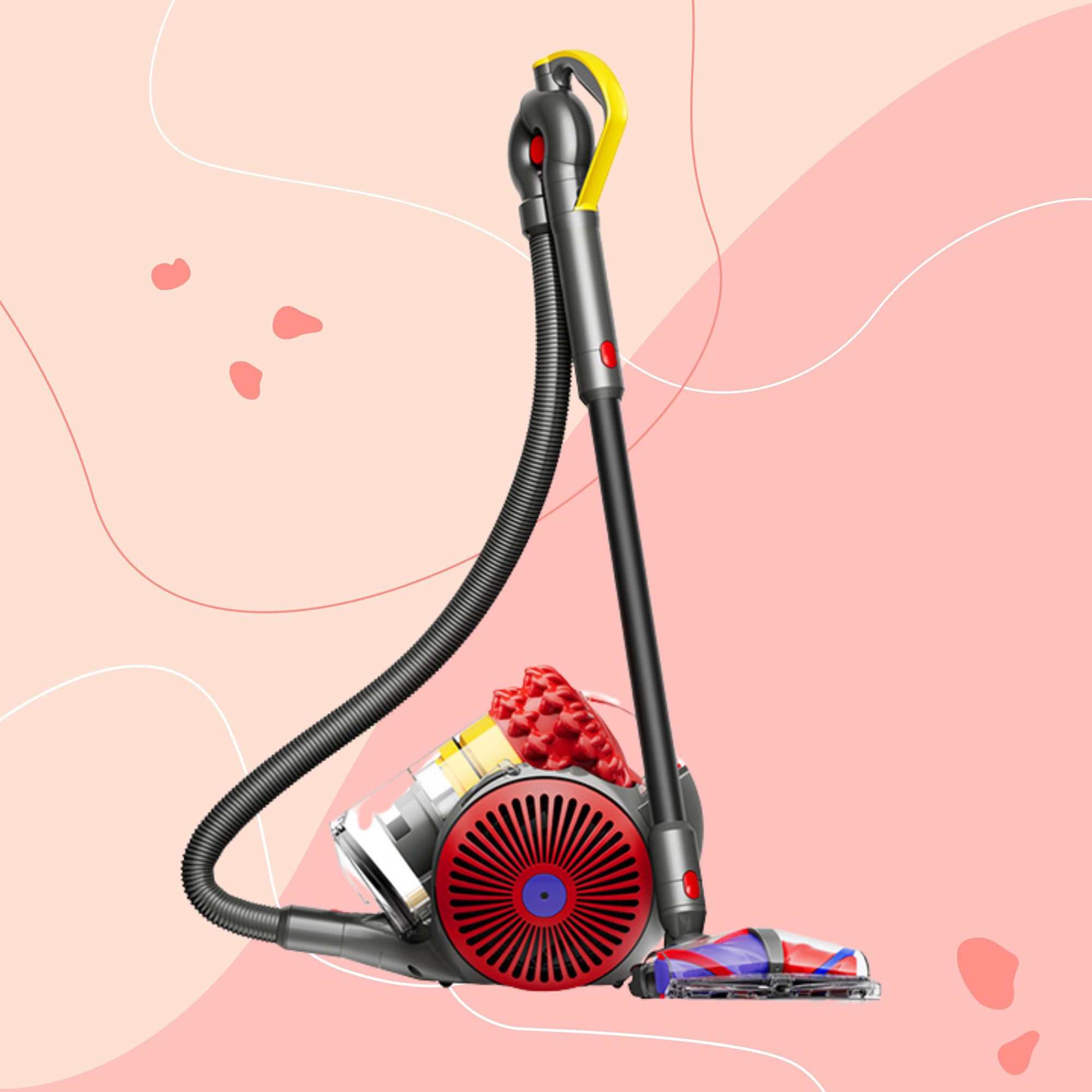 Dyson Big Ball Konical vacuum cleaner on a pink background