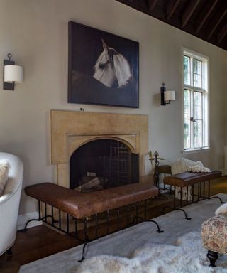 rustic living room with fireplace, large artwork and neutral walls