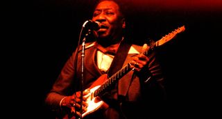 Muddy Waters plays his iconic red Telecaster onstage