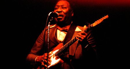 Muddy Waters plays his iconic red Telecaster onstage