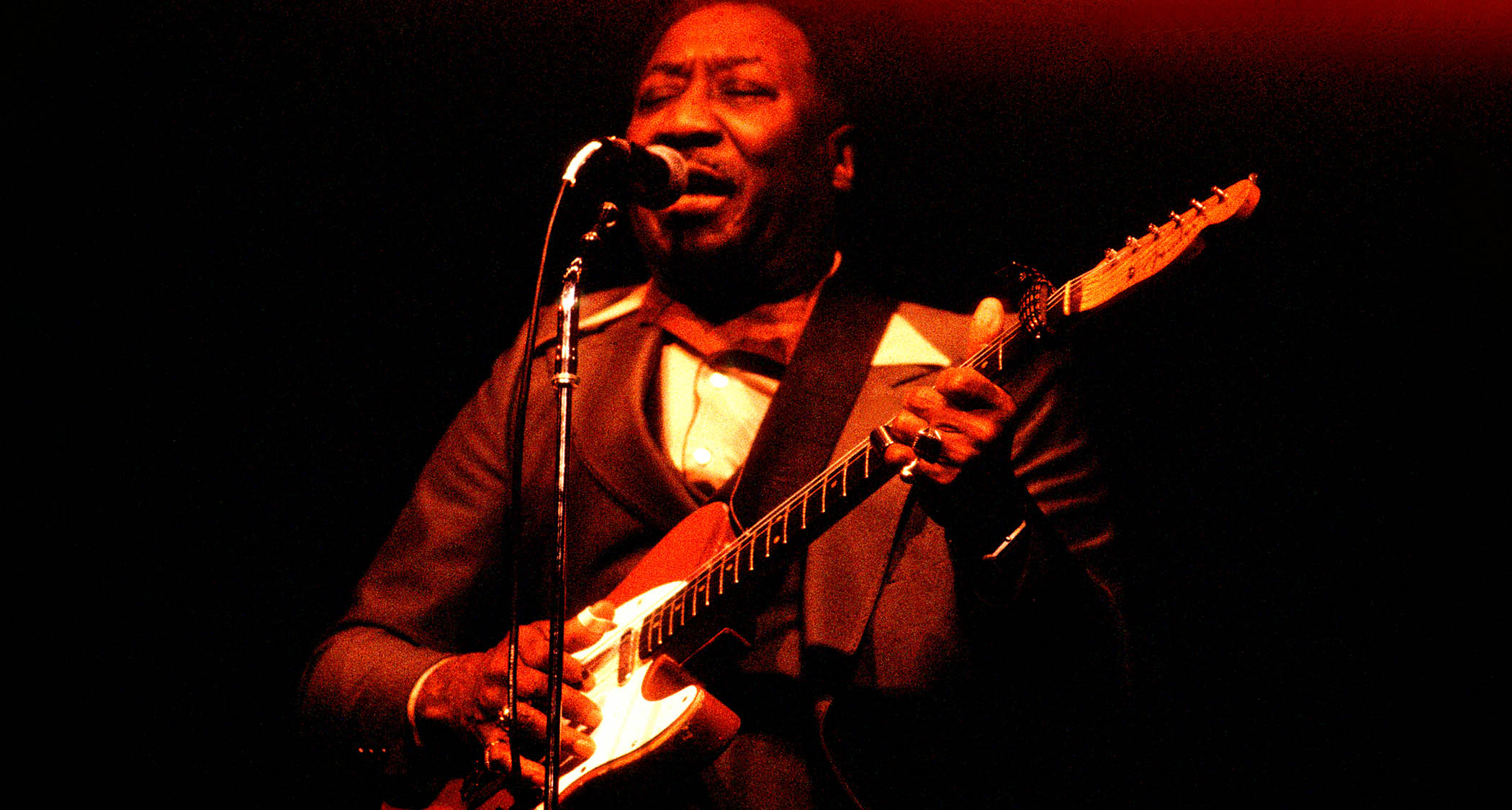 Muddy Waters plays his iconic red Telecaster onstage