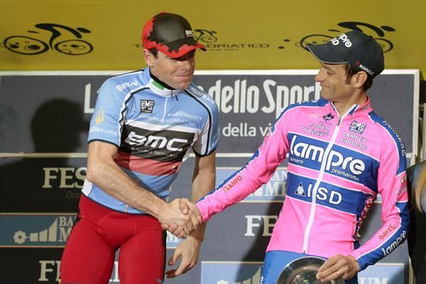 Tirreno-Adriatico champion Cadel Evans congratulates third-place finisher Michele Scarponi.