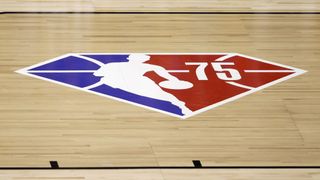 NBA logo representing the 75th season on a basketball court