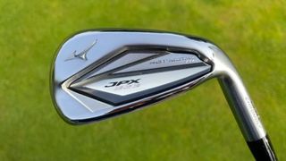 The Mizuno JPX923 Hot Metal HL Iron showing off its sleek back on the golf course