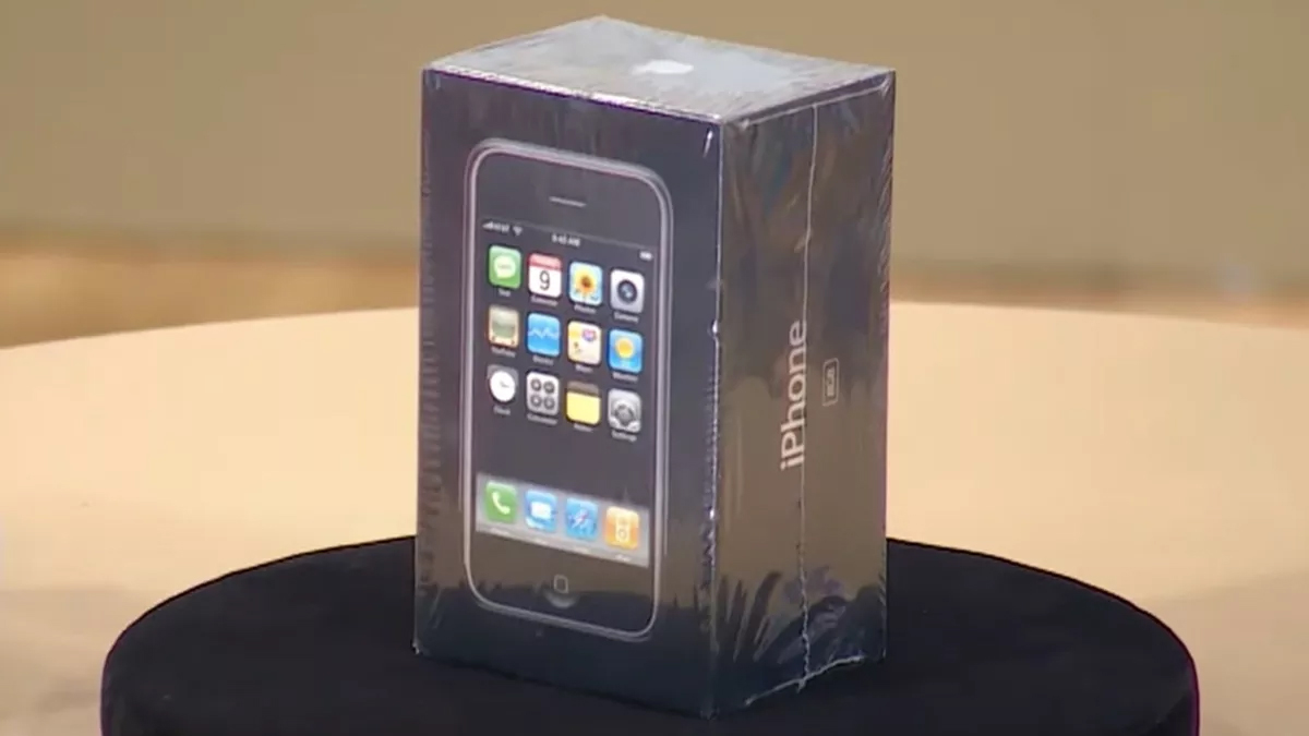 An unopened original Apple iPhone sat on a table