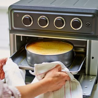 Cheesecake being cooked in air fryer oven