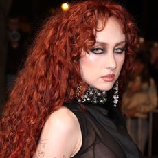 Chappell Roan attended the Alexander McQueen Fall 2026 fashion show in a naked dress and peekaboo thong