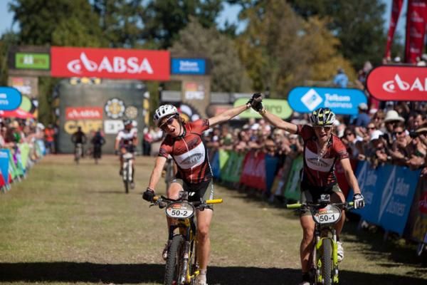 Winners Esther Suss and Sally Bigham of Wheels4life finish the final stage