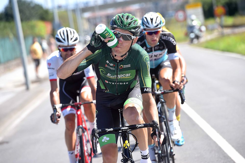 Pierre Rolland takes some refreshment during stage 15.