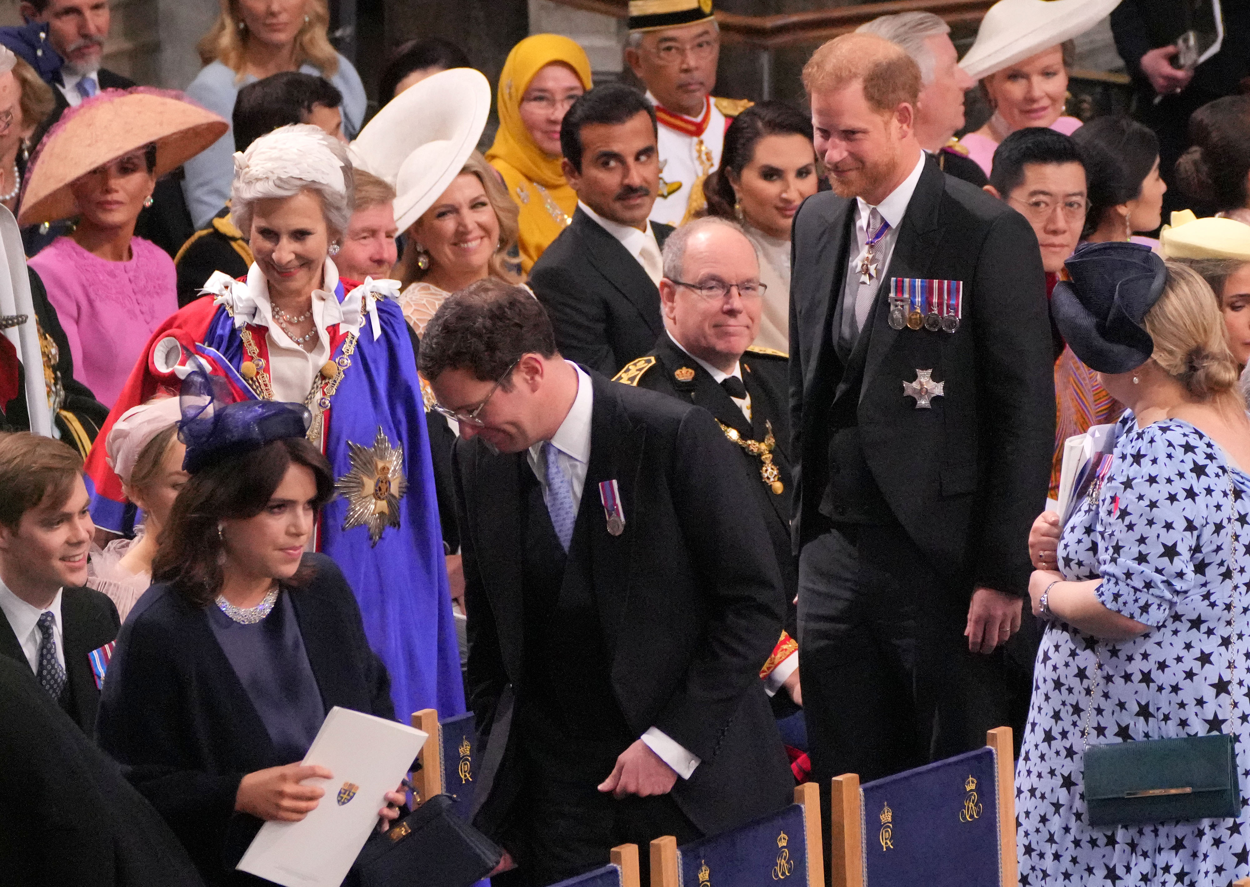 Prince Harry and Jack Brooksbank taking their seats at the coronation