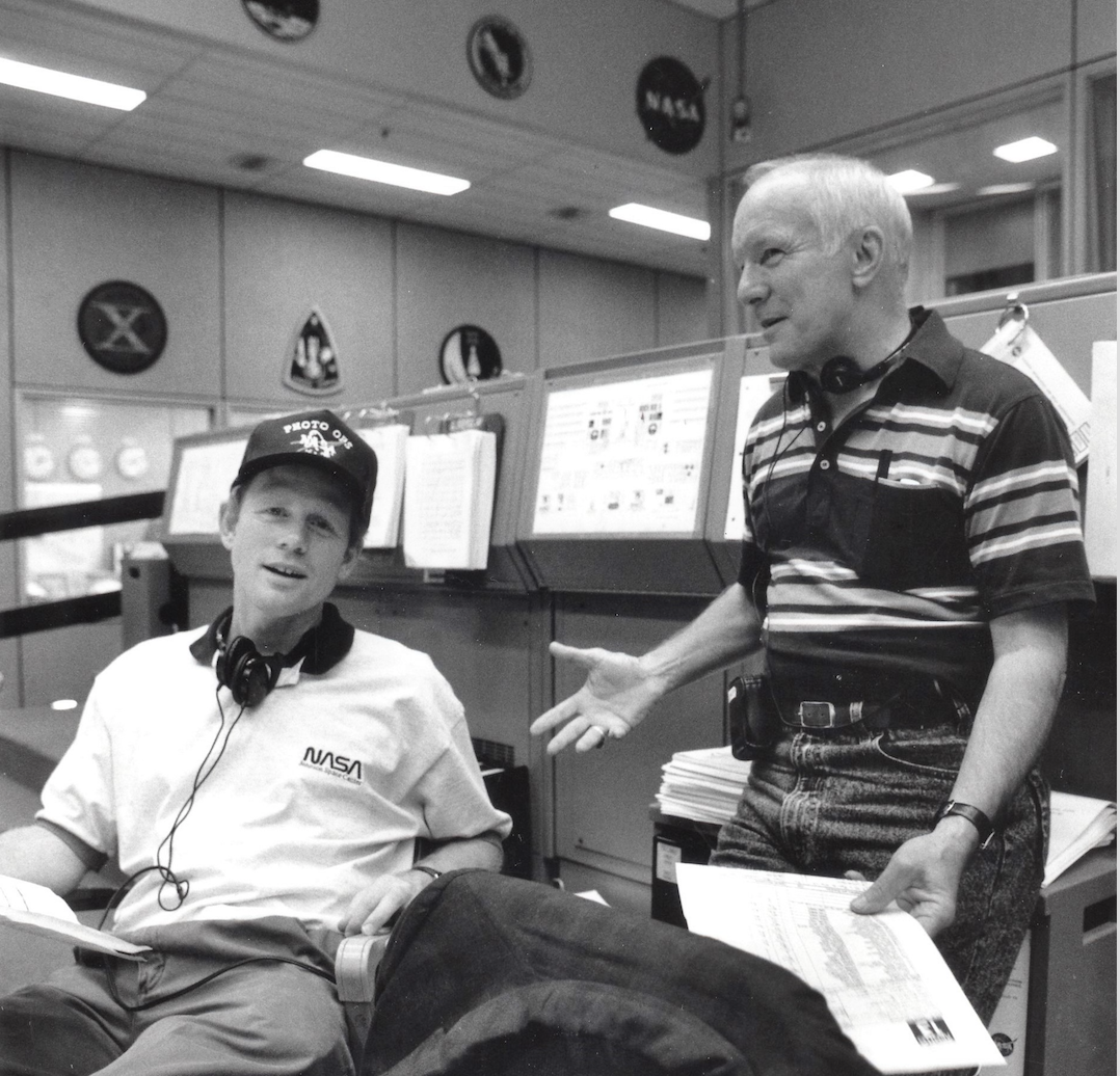 Two men on a movie set talking