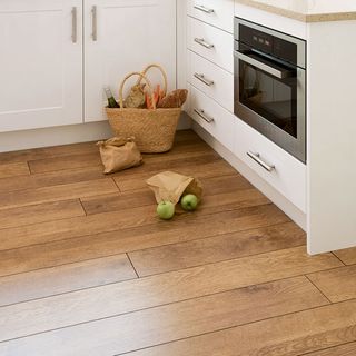 kitchen room with wooden flooring and kitchen cabinets