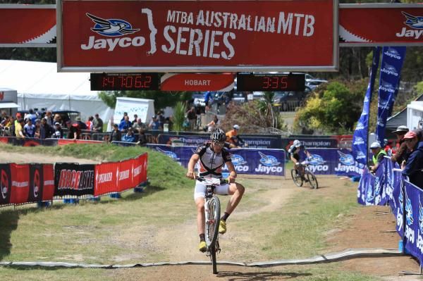 Paul van der Ploeg crosses the line in third place