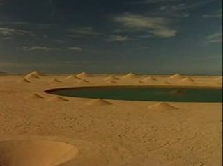 Constructed as two interlocking spirals — one with vertical cones, the other with conical depressions in the desert floor — Desert Breath was originally designed with a small lake at its center, but recent images on Google Maps show that the lake has empt