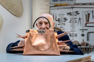 Arnaldo Pomodoro photographed with his barbed take on Fendi’s Peekaboo bag, which will be on display for the duration of the show