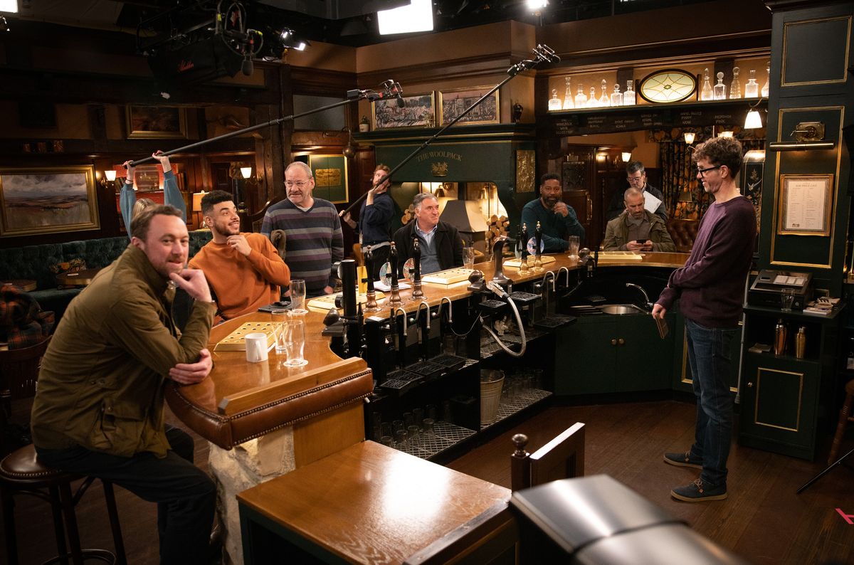 The men filming at the Woolpack in Emmerdale