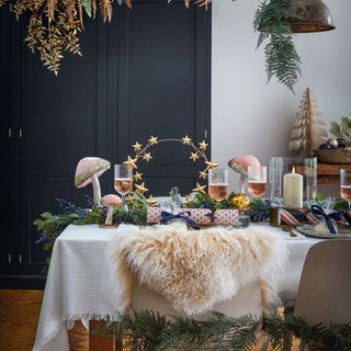 Dining room decorated with Christmas decorations and festive tablescape