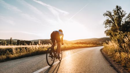 Male cyclist riding a cheap road bikes