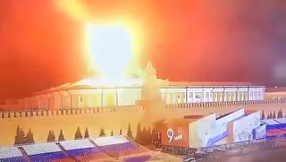 A CCTV image shows flames and smoke above the dome of the Kremlin Senate building on 3 May