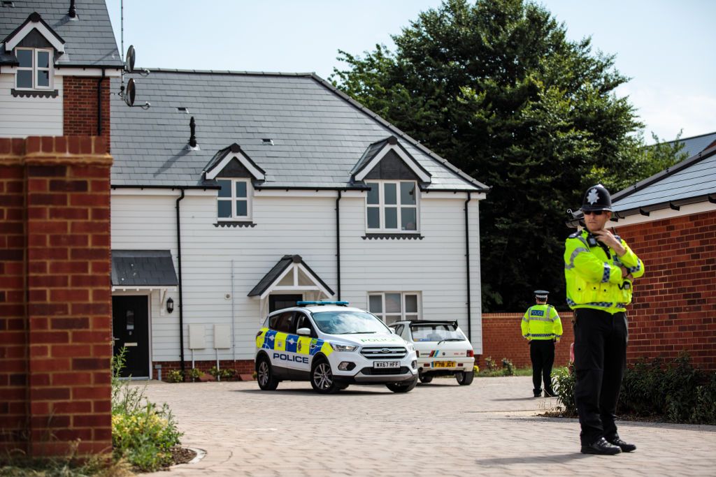 Police cordoned off a home where two people were sickened by an unknown substance.