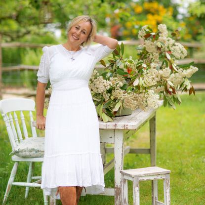 Shirlie Kemp in garden in white dress