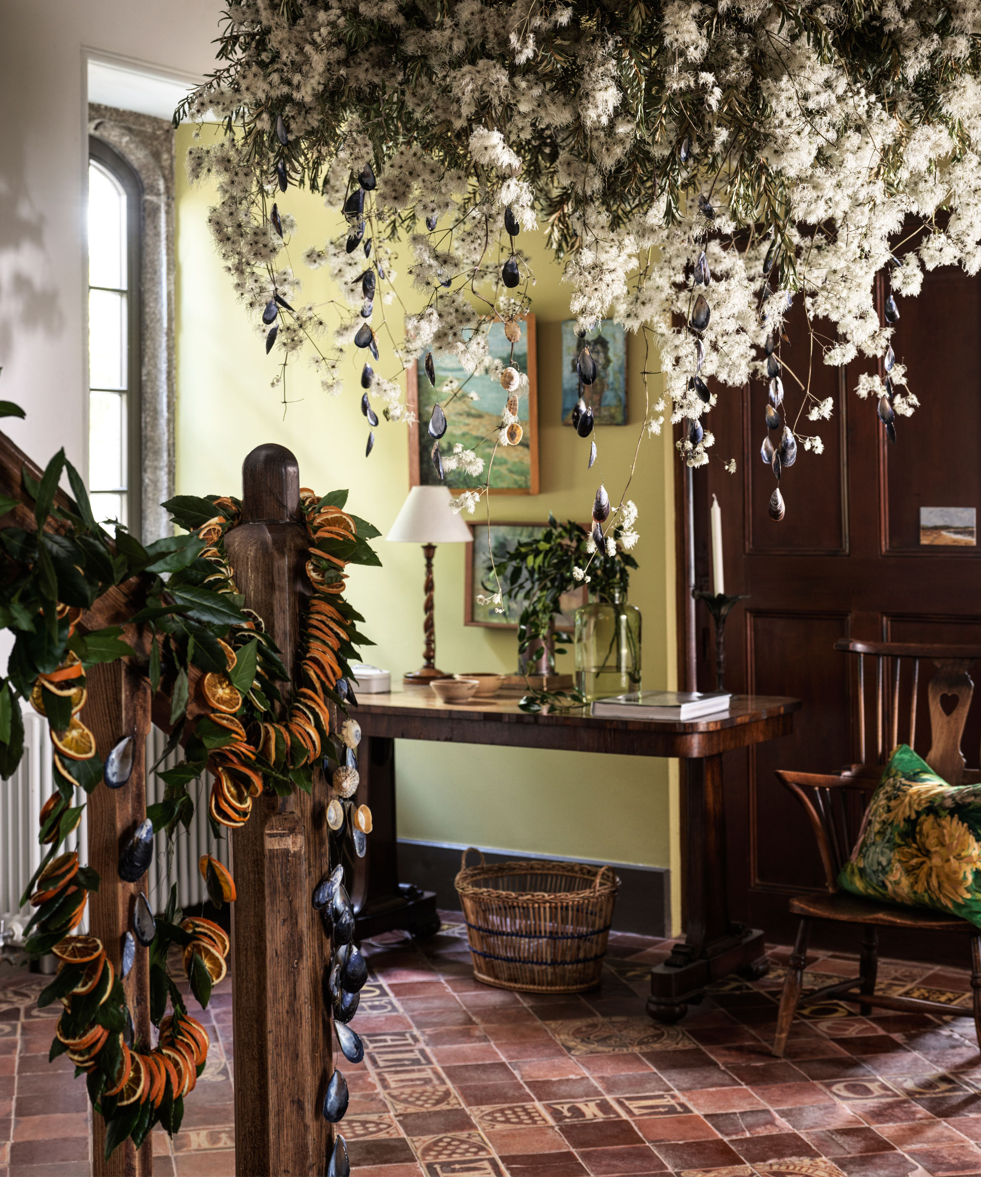 Rustic entryway decorated with festive foliage and flowers