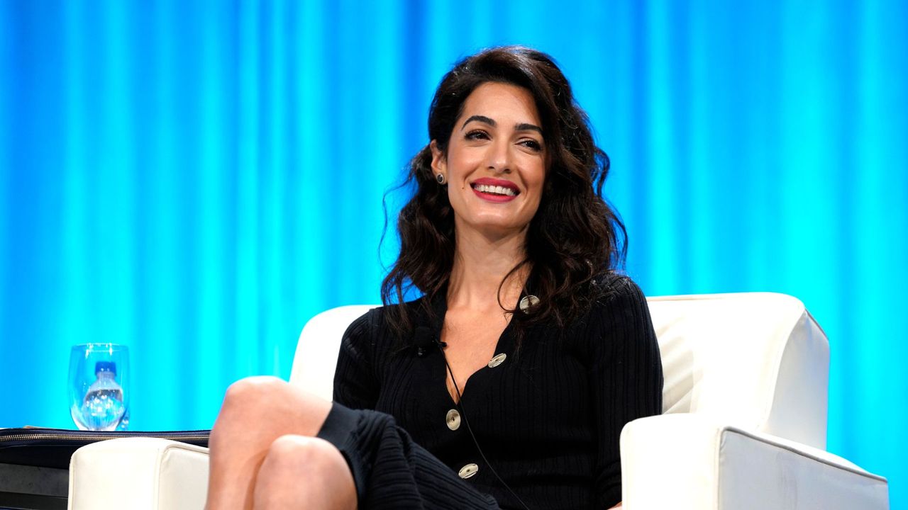 Human rights lawyer Amal Clooney speaks on stage with Editor in chief for Glamour magazine Samantha Barry during Pennsylvania Conference for Women 2018 at Pennsylvania Convention Center on October 12, 2018 in Philadelphia, Pennsylvania. 