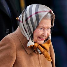 Queen Elizabeth wearing a Burberry head scarf