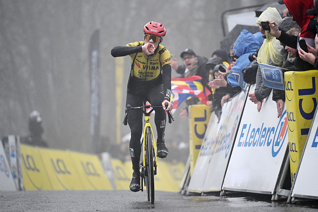 Jonas Vingegaard celebrates winning a stage of Paris-Nice 2026 in poor weather