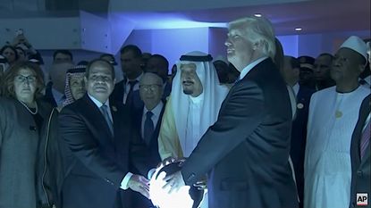Trump, Saudi King Salman, and Egypt's president touch a glowing orb