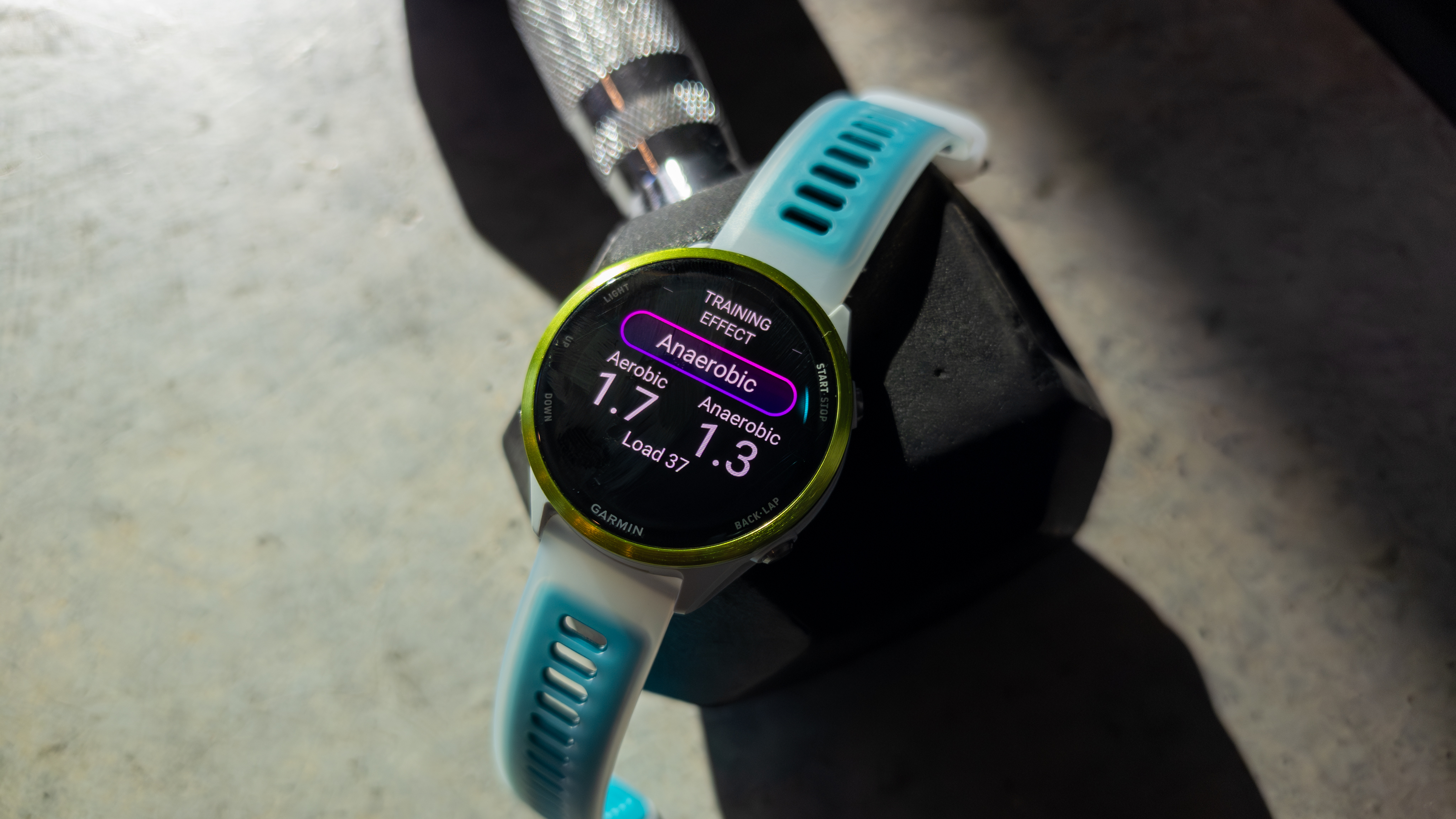 Garmin Forerunner 570 on a dumbbell with Training Effect stats on it