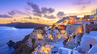 The white homes reflecting light in the village of Oia