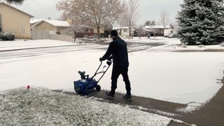 Snow Joe 48V Max Cordless Snow Blower being tested in writer's home