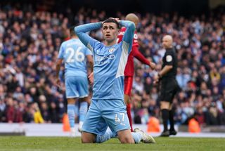 Manchester City’s Phil Foden shows his frustration after Riyad Mahrez missed a late chance against Liverpool