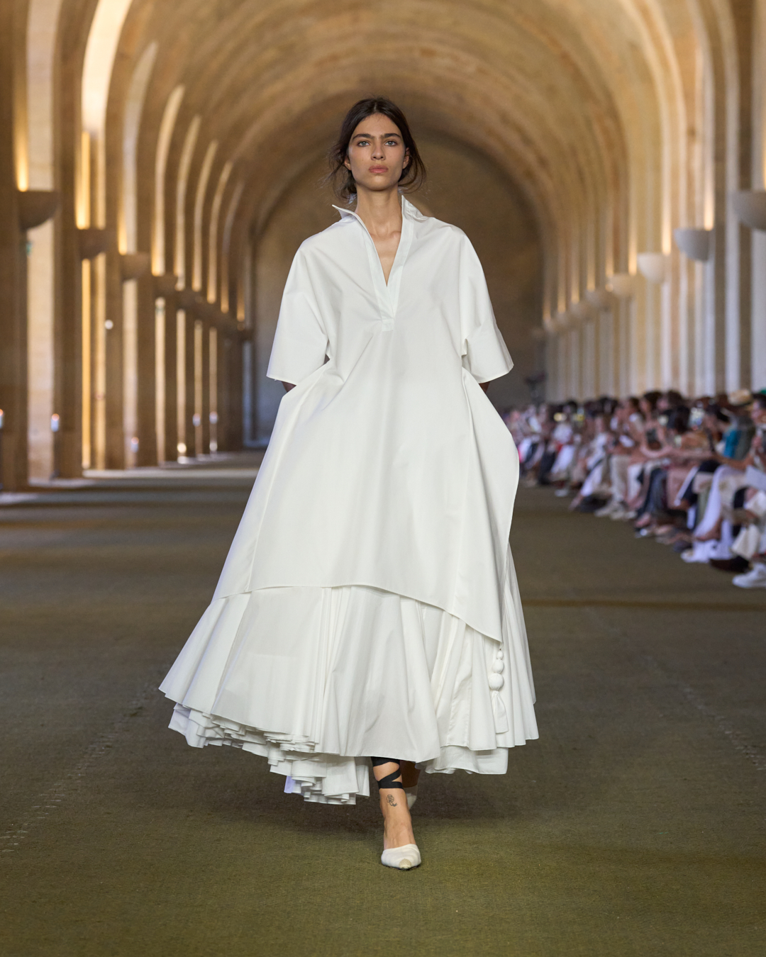 A woman walks the jacquemus show/