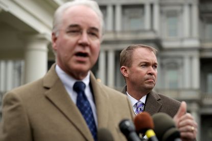Tom Price (L) and Mick Mulvaney talk to reporters following the release of the Congressional Budget Office report.