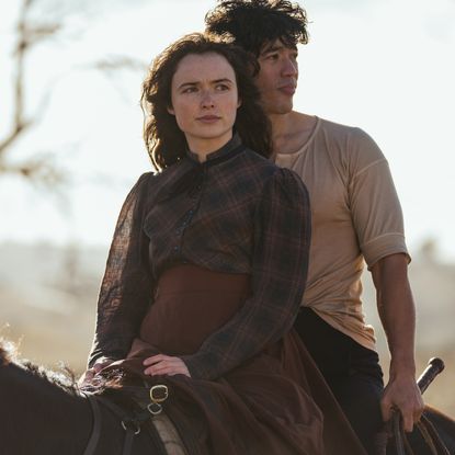 Phillipa Northeast as Sybylla and Christopher Chung as Harry sit astride a horse on Netflix's 'My Brilliant Career.'
